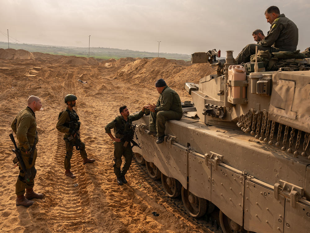 Israeli soldiers and artillery in southern Israel by the border with the Gaza Strip, on Dec. 27.