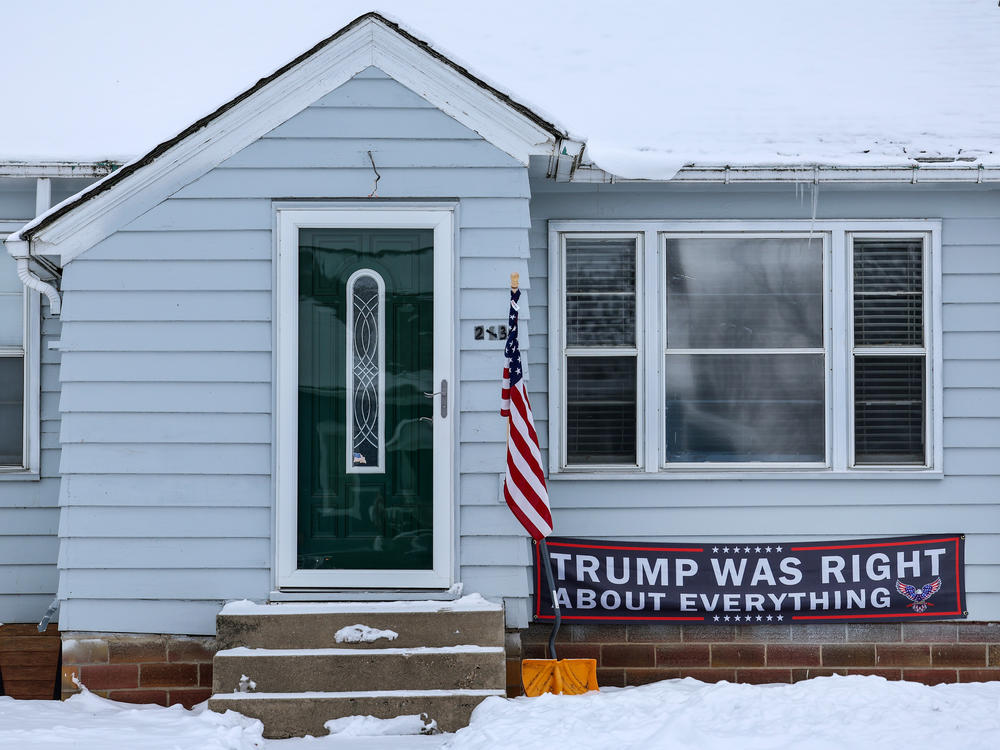 A sign supporting Republican presidential candidate former President Donald Trump a house in Ogden, Iowa on Jan. 12, ahead of the Republican presidential caucuses.