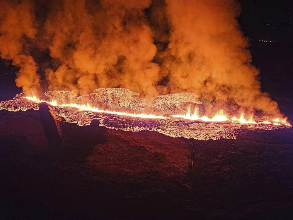 In this photo provided by Civil Protection taken from the Coast Guard's helicopter, a view of lava as the volcano erupts near Grindavík, Iceland, on Sunday.