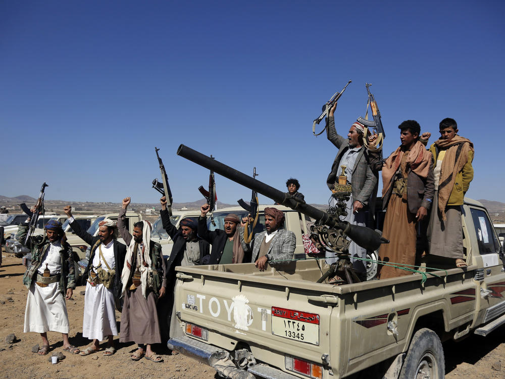 Houthi fighters and tribesmen stage a rally against U.S. and U.K. strikes on Houthi-run military sites near Sanaa, Yemen, on Sunday, Jan. 14, 2024.