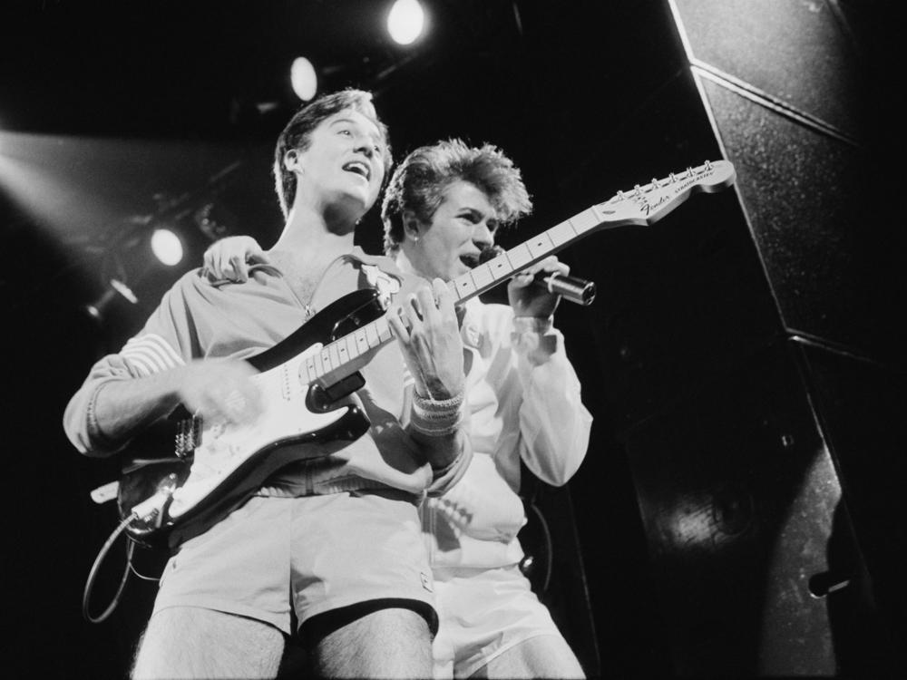 Andrew Ridgeley and George Michael of pop duo Wham! perform in London in November 1983.