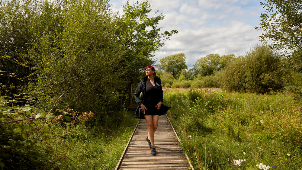 Three days before the start of the Miss Trans Global pageant, Chedino takes a break from sewing her national costume by going for a walk in the Riverside Nature Reserve in Guildford, U.K., on July 28, 2023.