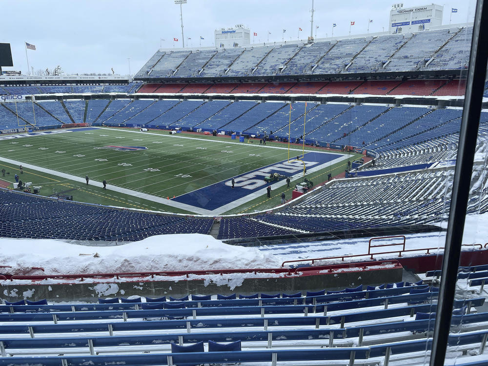 A few flurries fall at the stadium mostly-cleared of snow in Orchard Park, N.Y, ahead of the NFL football game between the Buffalo Bills and Kansas City Chiefs on Sunday.