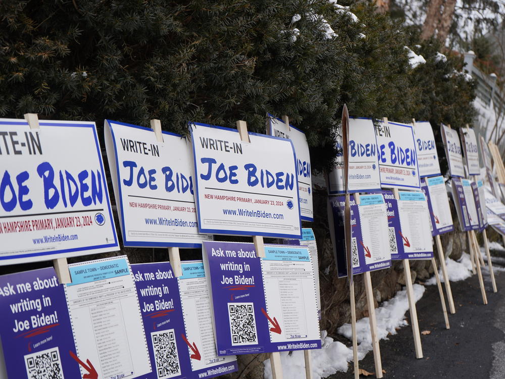 Signs line a driveway in Concord, N.H., waiting for volunteers to pick them up. President Biden is not on the New Hampshire primary ballot because of a dispute over Democratic Party rule changes.