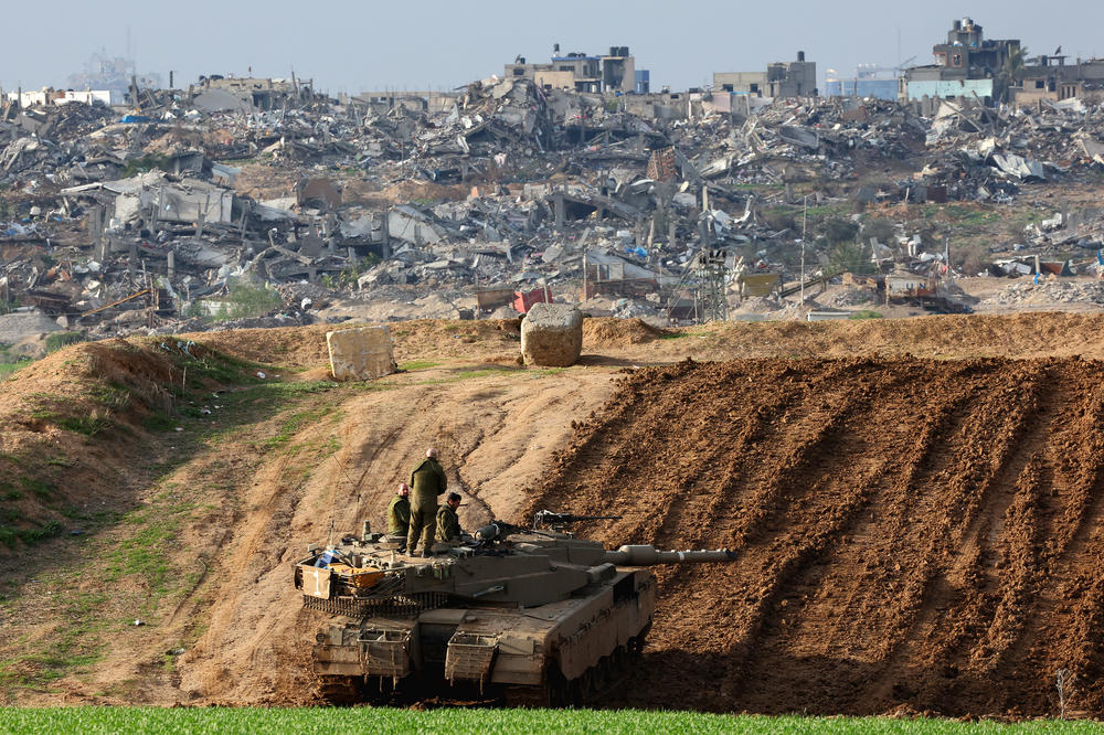 An Israeli battle tank is positioned along the border with the Gaza Strip in southern Israel on Jan. 17.