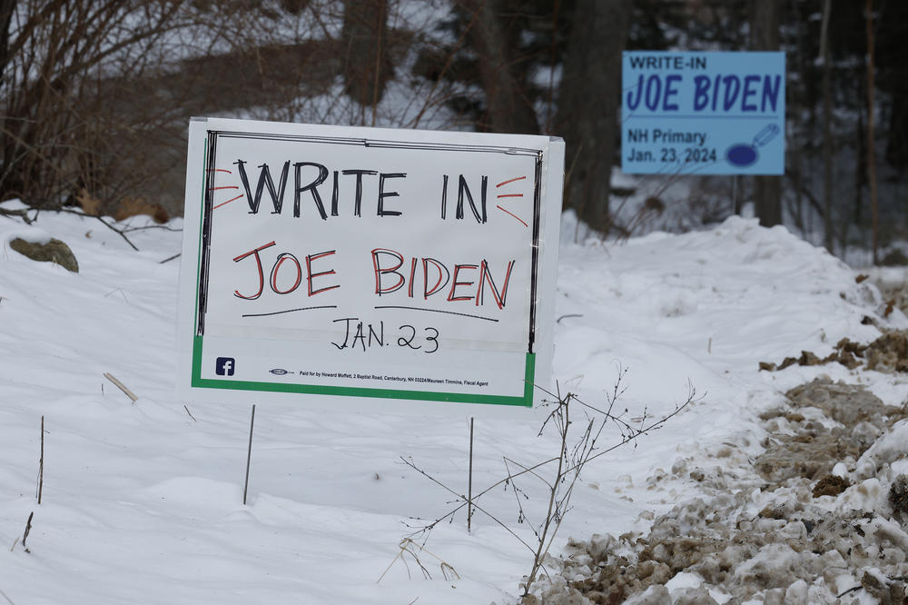 Campaign signs asking voters to write in President Biden on the primary ballot are seen in Loudon, N.H., on Friday.