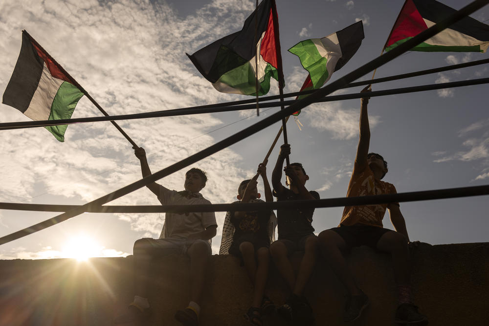 Palestinian demonstrators protest in Burj al-Barajneh camp in Beirut, on Oct. 11.