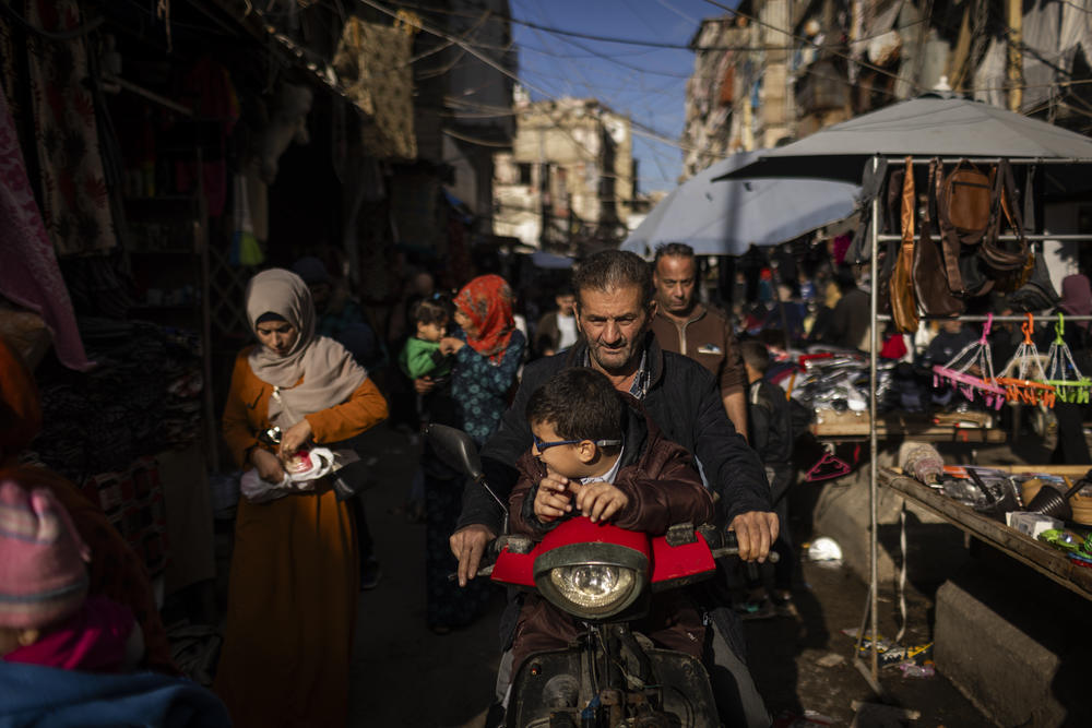 Palestinians transit through the streets of the crowded Shatila refugee camp.