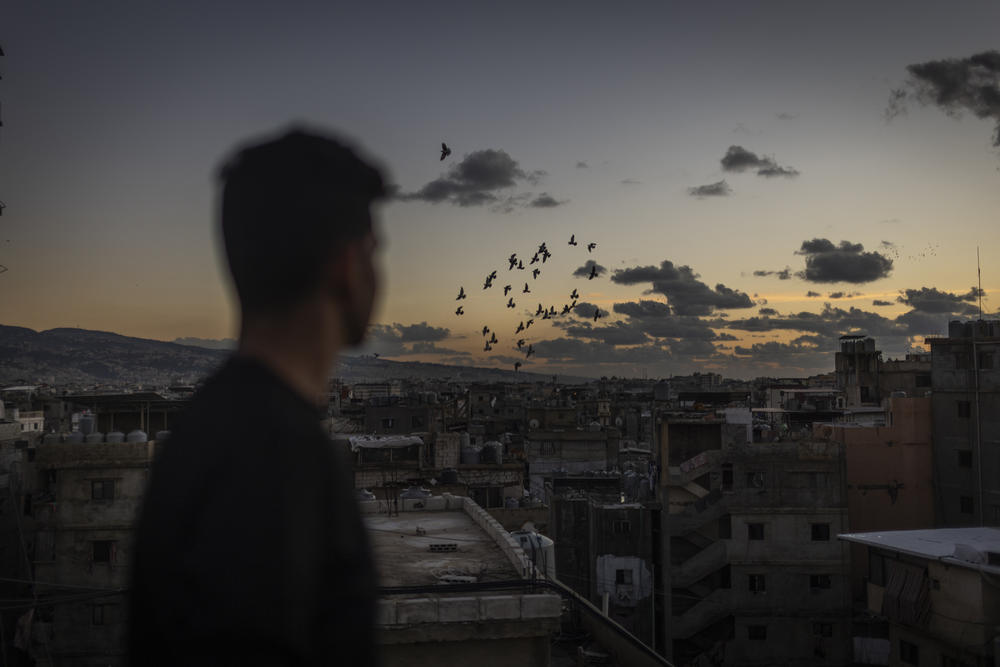 A Palestinian looks out onto the Shatila refugee camp.