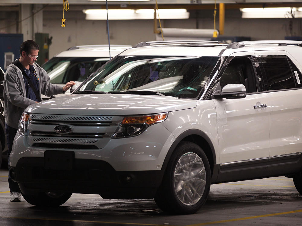 A worker assembles a 2011 Ford Explorer at the Chicago Assembly Plant in 2010 in Chicago. Ford is recalling nearly 1.9 million Explorers in the 2011-2019 model years over a piece of trim that can detach from the vehicles.