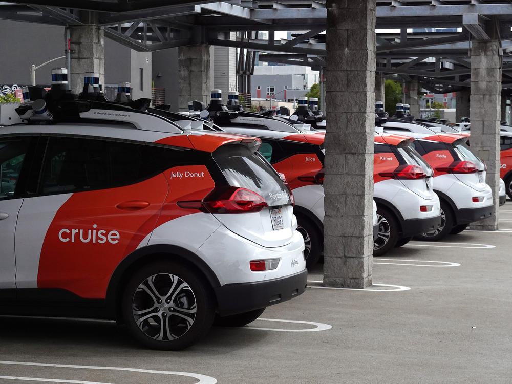Cruise autonomous vehicles sit parked in a lot in June 2023 in San Francisco, Calif. The company's fleet of robotaxis have not been operating for the past few months, after the company's response to a crash in October raised concerns with regulators.