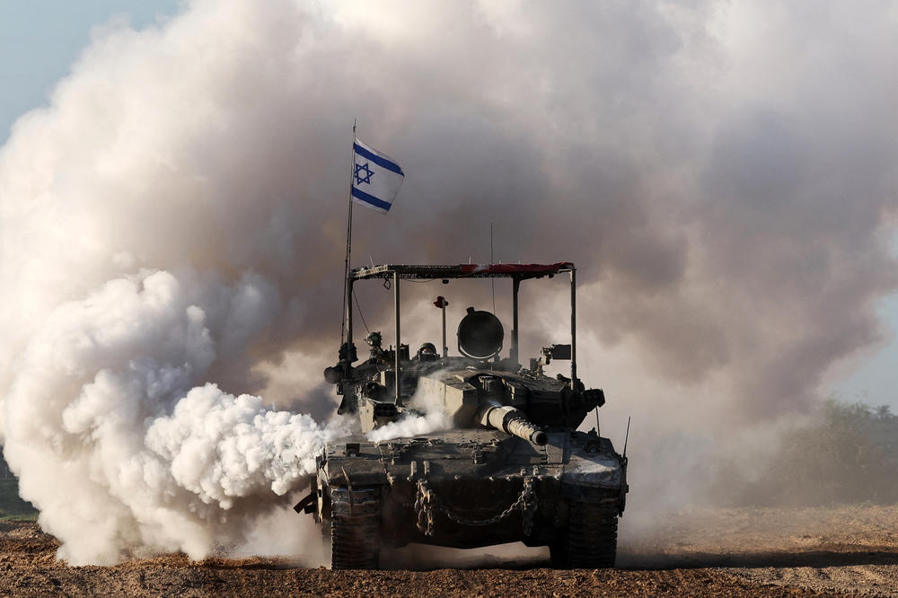 An Israeli army tank rolls in southern Israel along the border with Gaza on January 24.