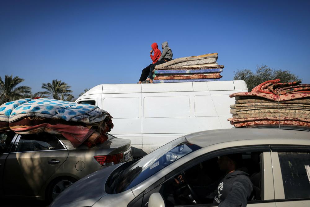 Palestinian families flee Khan Younis, in southern Gaza, on Jan. 22.