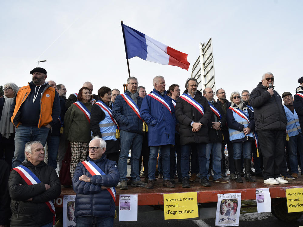 Jerome Guillem, mayor of Langon, and other French mayors, farmers and wine growers block highway entrances to the town of Langon, toward the A62 highway in Gironde, France, on Jan. 29.