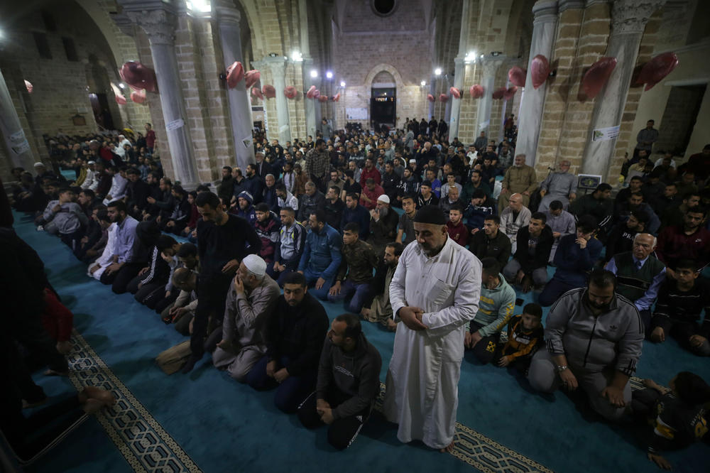 Palestinian devotees pray on Laylat al-Qadr at the Omari mosque during the Muslim holy month of Ramadan in Gaza City, on April 17, 2023.