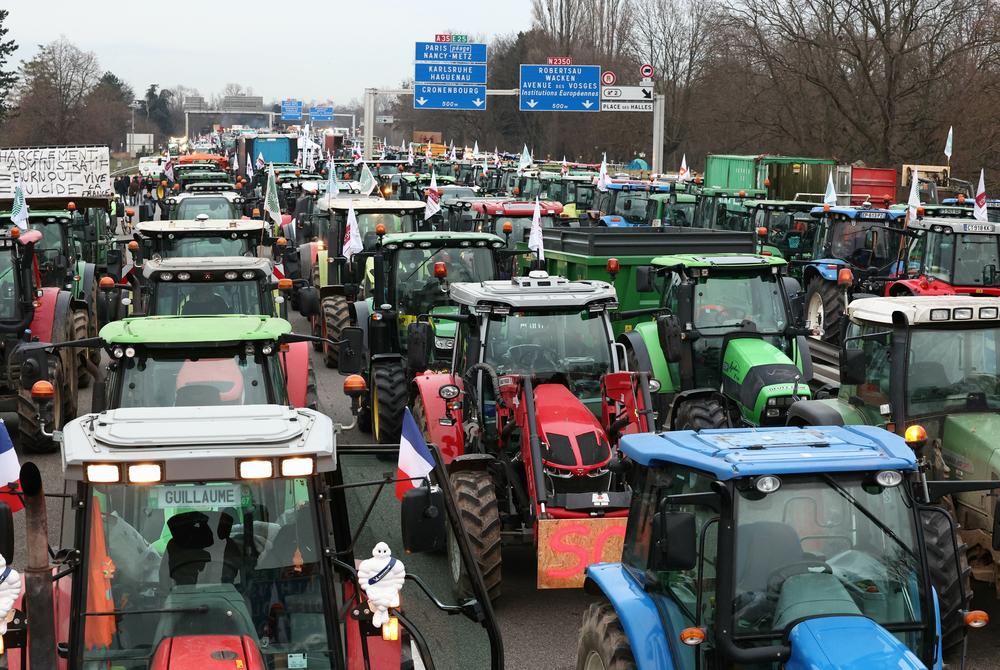 Farmers take part in a protest called by local branches of major farm unions, blocking the A35 highway with tractors near Strasbourg, eastern France, Jan. 30, amid nationwide protests called by farmers' unions.
