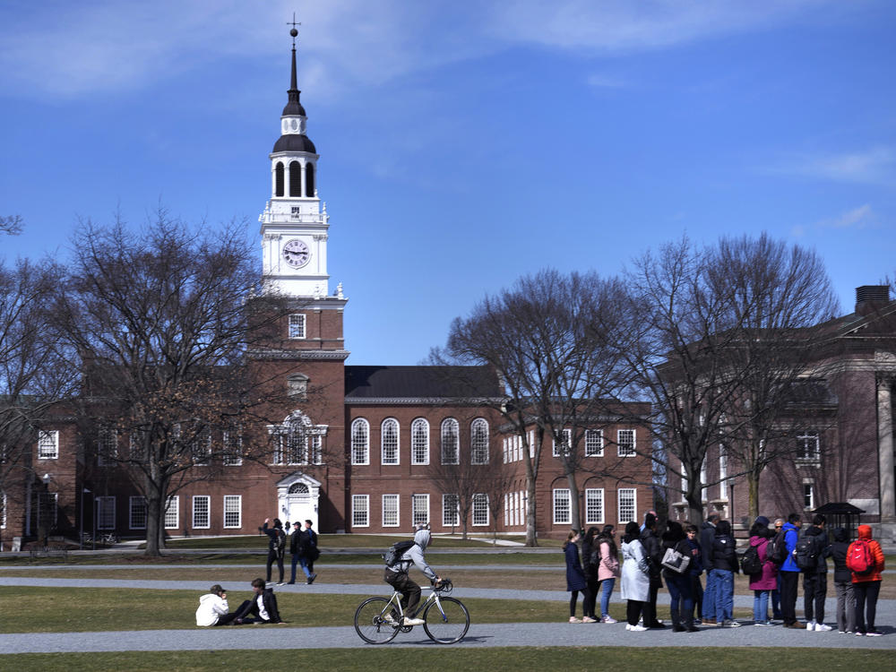 A tour group makes its way through Dartmouth College's campus, in Hanover, N.H., in April 2023.