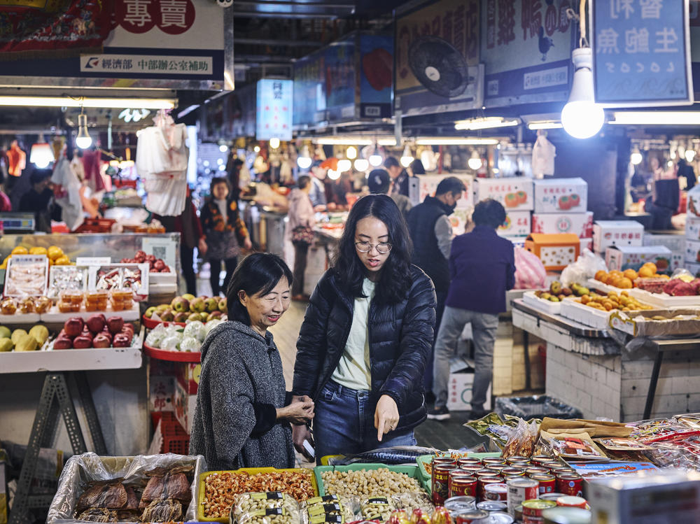 Ivy Chen (left) and Clarissa Wei browse Shuixian Gong Market in Tainan, Taiwan, in January.