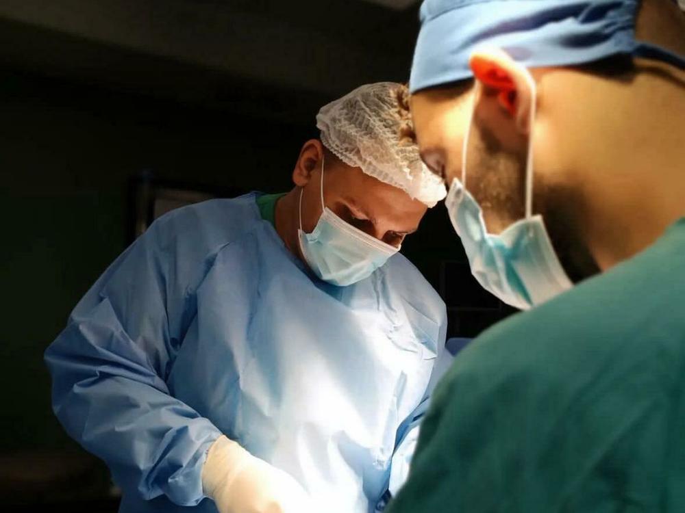 Dr. Khaled al-Serr, performing surgery at Nasser Hospital in Khan Younis.