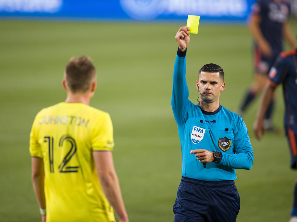 Alistair Johnston of Nashville SC is issued a yellow card during the second half of a match against FC Cincinnati at Nissan Stadium on April 17, 2021 in Nashville.