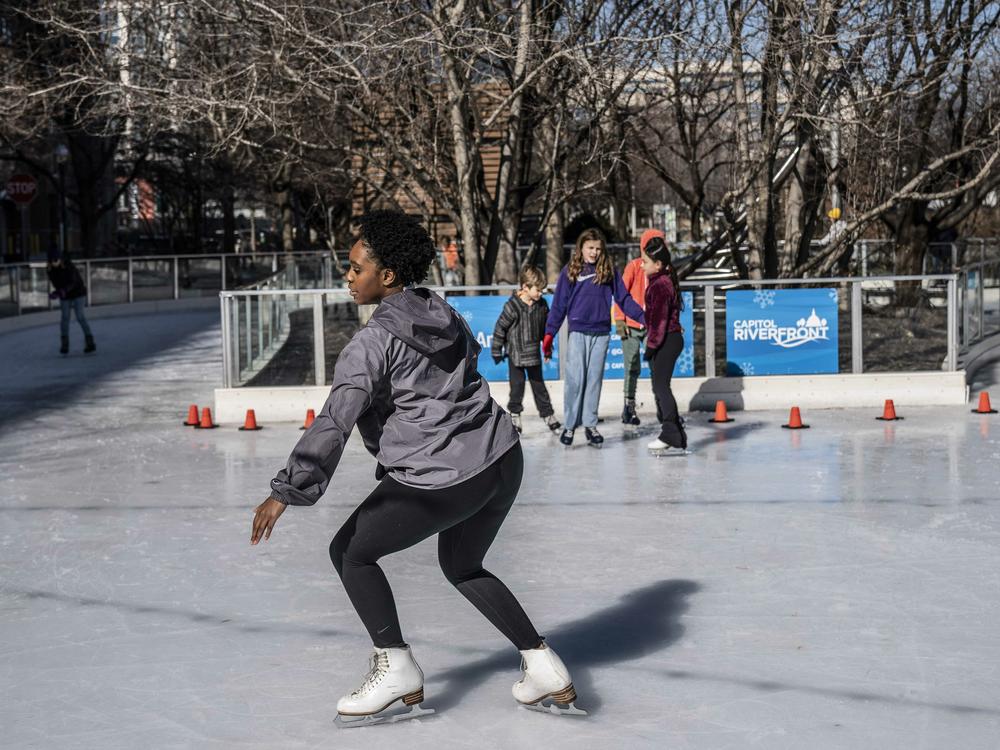 Cheyenne Walker, Co-Founder and Vice President of Howard University Ice Skating Organization prepares to perform a scratch spin at Canal Park Ice Rink in Washington, D.C.