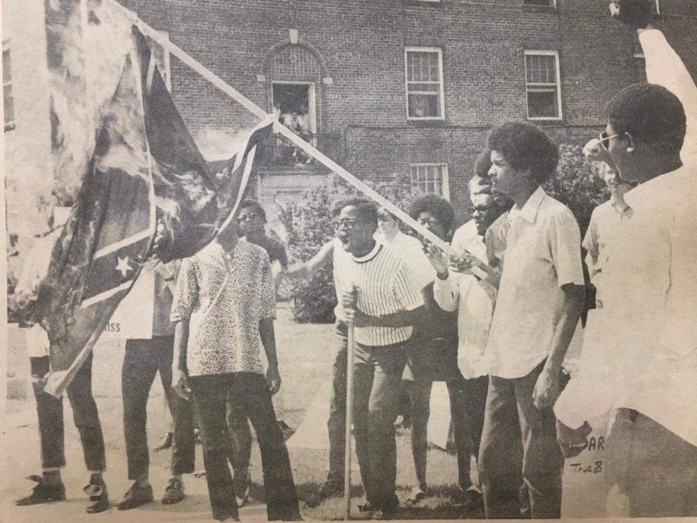 Black students burn a Confederate battle flag in protest at the University of Mississippi. In 1970, the Black Student Union demanded that Ole Miss disassociate with Confederate symbols. They said waving the flag was a reminder that Ole Miss was still a 