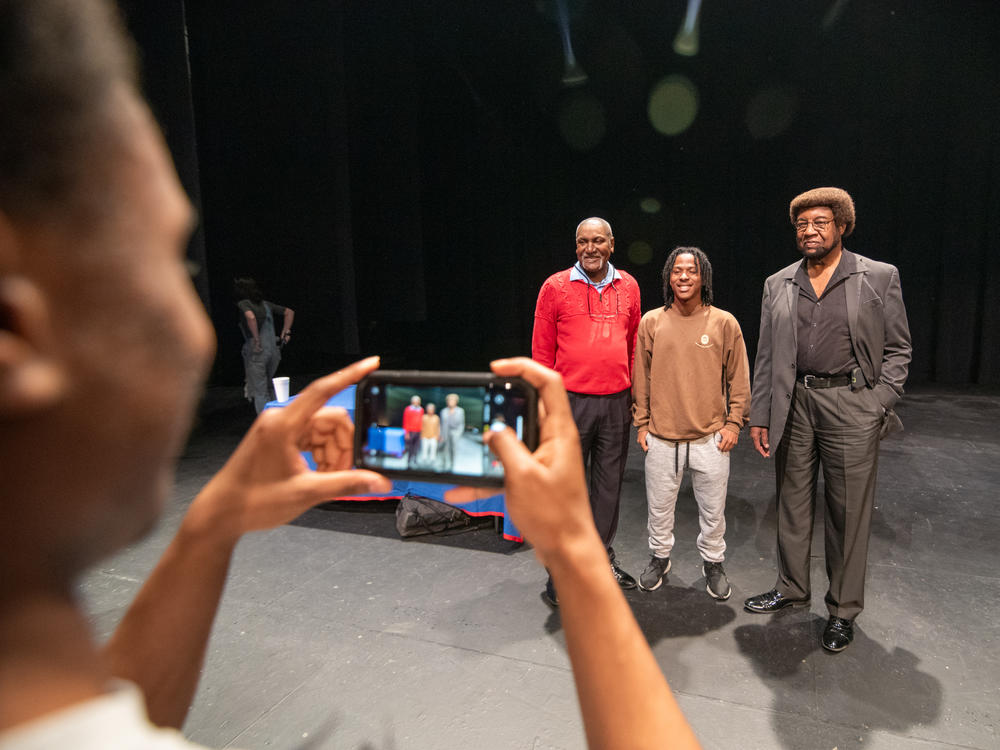 University of Mississippi student, Jordan Isbell, 20, takes pictures of fellow student, Razabier Davis, 20 with left, Donald Cole and Kenneth Mayfield on the stage of Fulton Chapel on Feb. 15.