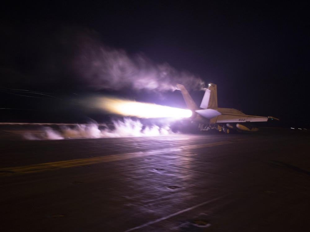 This image provided by the U.S. Navy shows an aircraft launching from USS Dwight D. Eisenhower in the Red Sea last month. The U.S. and Britain struck more than a dozen Houthi targets in Yemen on Saturday, military officials said.