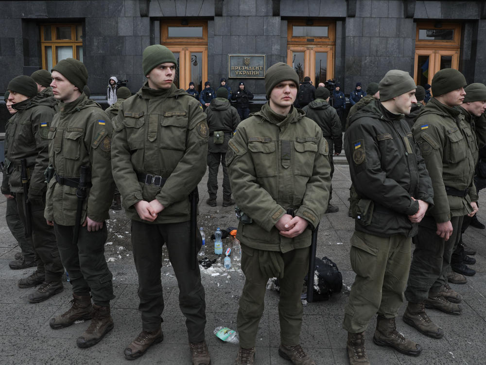 National Guards surround the place where a person immolated himself earlier in Kyiv, Ukraine, on Feb. 26, 2020. A man doused himself with a flammable liquid and set himself on fire in front of Presidential Office.