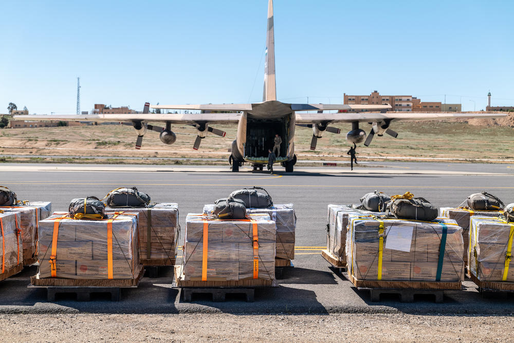 Pallets of aid on the tarmac wait to be loaded into a Jordanian Air Force C-130 aircraft before an airdrop mission over Gaza.