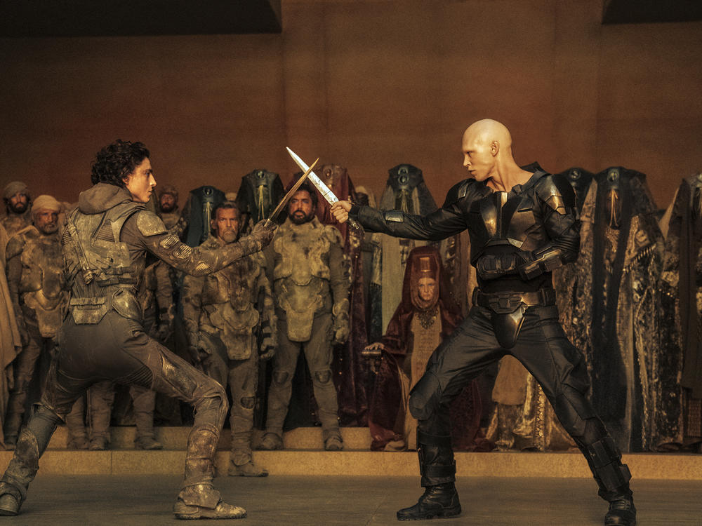 This image released by Warner Bros. Pictures shows Timothee Chalamet, foreground left, and Austin Butler in a scene from <em>Dune: Part Two</em>.