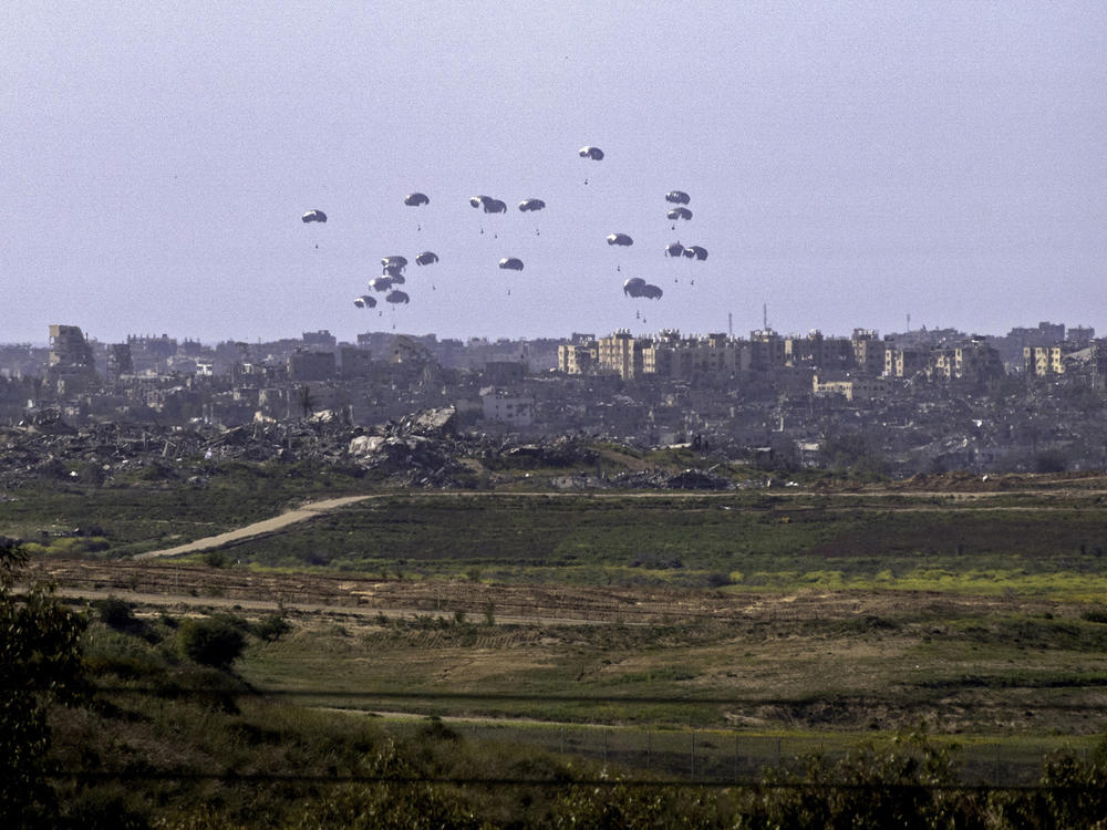 Aid parcels being airdropped over the northern Gaza Strip on March 5.