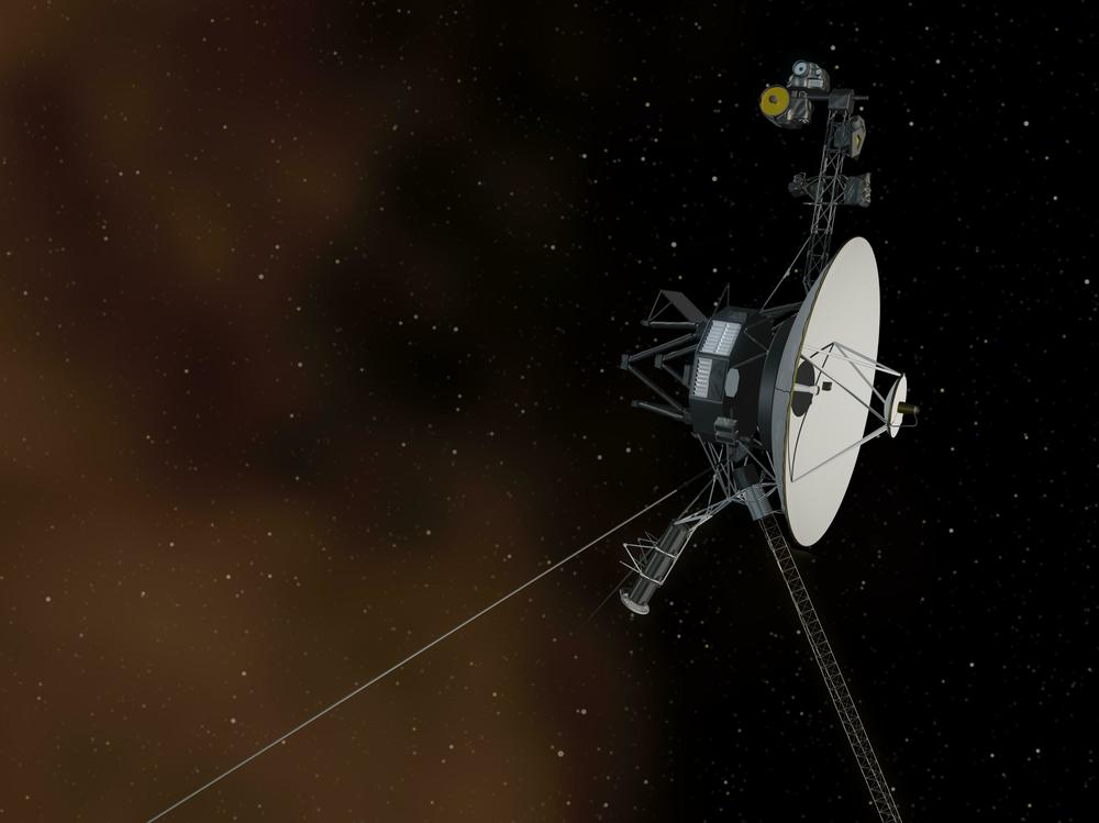 This artist's concept shows the Voyager 1 spacecraft entering the space between stars. Interstellar space is dominated by plasma, ionized gas (illustrated here as brownish haze).