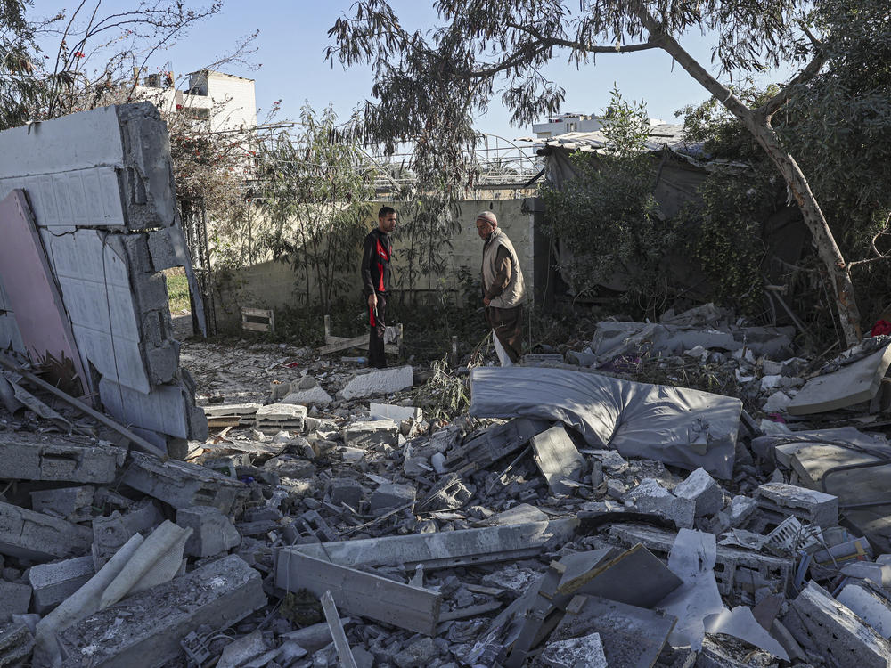 Palestinians search for their belongings amid the rubble of houses destroyed by an Israeli bombardment in Rafah in the southern Gaza Strip on March 11.