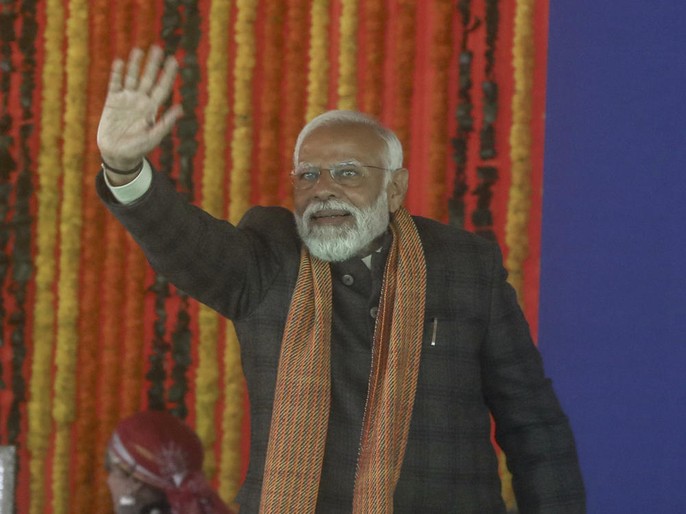 Indian Prime Minister Narendra Modi waves at a public rally at the Bakshi Stadium in Srinagar, Indian-controlled Kashmir, on March 7.