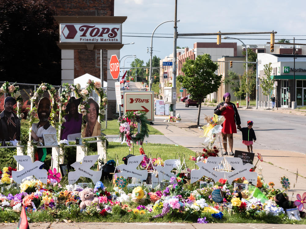 A memorial to the 10 victims of the racist shooting at a Tops grocery store in Buffalo. Two tech companies must face a lawsuit alleging that their algorithms played a role in radicalizing the shooter, a judge ruled Monday.