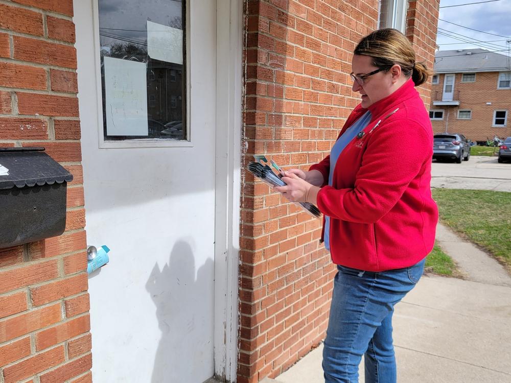 Sarah Harrison knocks on doors for Democrats on March 17 in Waukesha, Wisc., working through a list of 29 addresses that the party database said were home to likely Democratic voters.