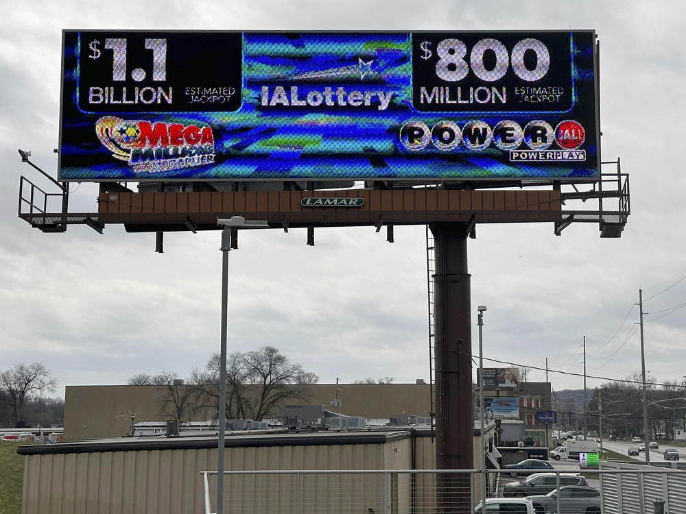 An electronic billboard advertises the Mega Millions and Powerball jackpots, Monday, March 25, 2024, in in Des Moines, Iowa.
