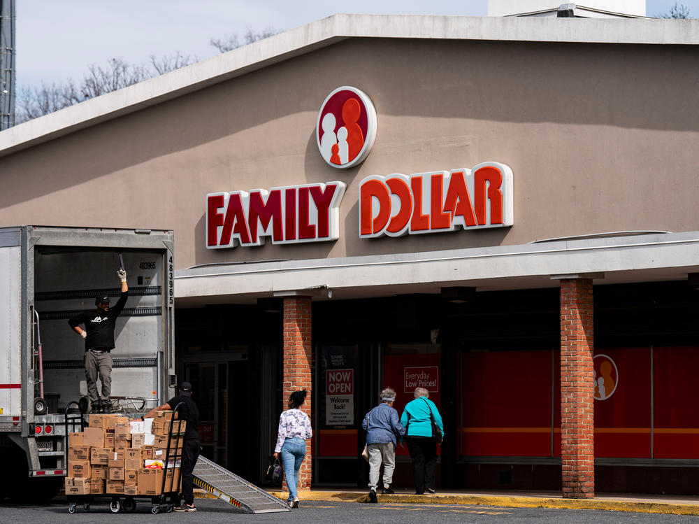 Shoppers walk past a delivery truck outside a Family Dollar in Hyattsville, Maryland. Family Dollar has announced it's closing 600 stores this year.