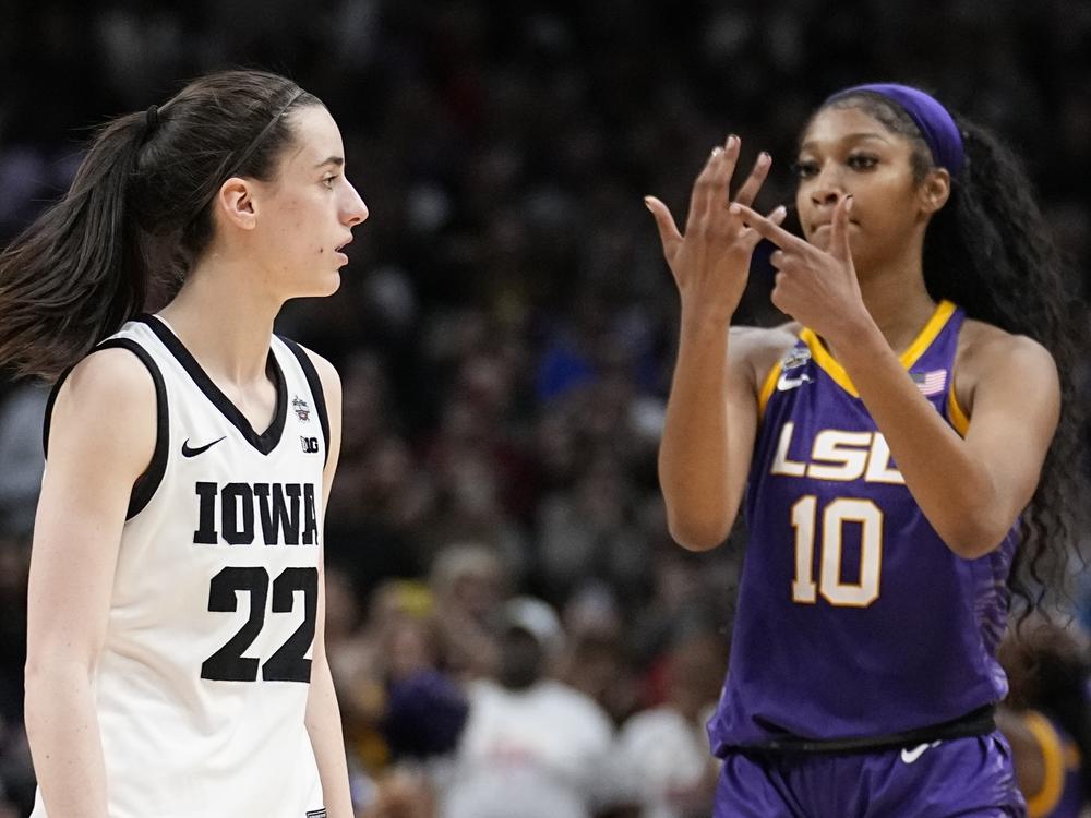 LSU's Angel Reese reacts in front of Iowa's Caitlin Clark during the second half of the NCAA Women's Final Four championship basketball game April 2, 2023, in Dallas.