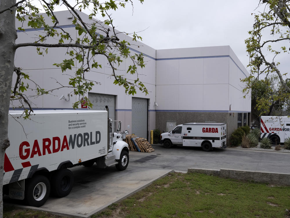 Armored trucks are parked outside the GardaWorld facility in the Sylmar section of Los Angeles on Thursday, April 4, 2024.