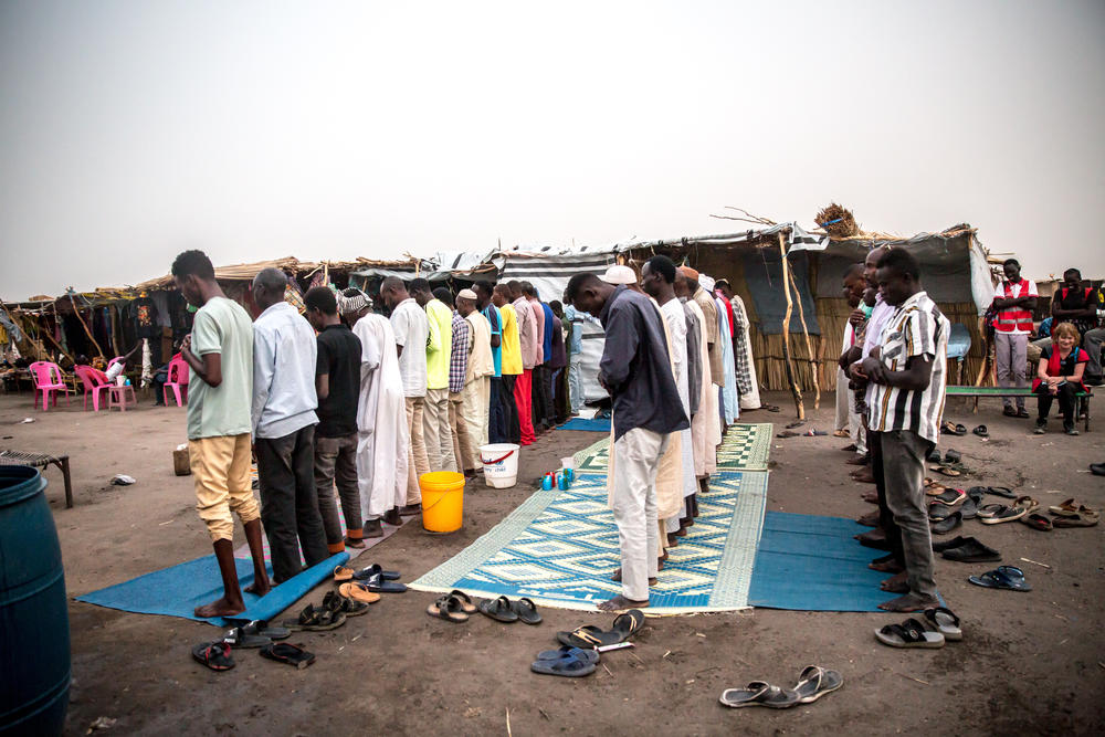Men pray after breaking fast during Ramadan, as the Muslim holy month is observed by Sudanese refugees and South Sudanese returnees, who have fled the Sudanese war, in a transit center in Renk, South Sudan.