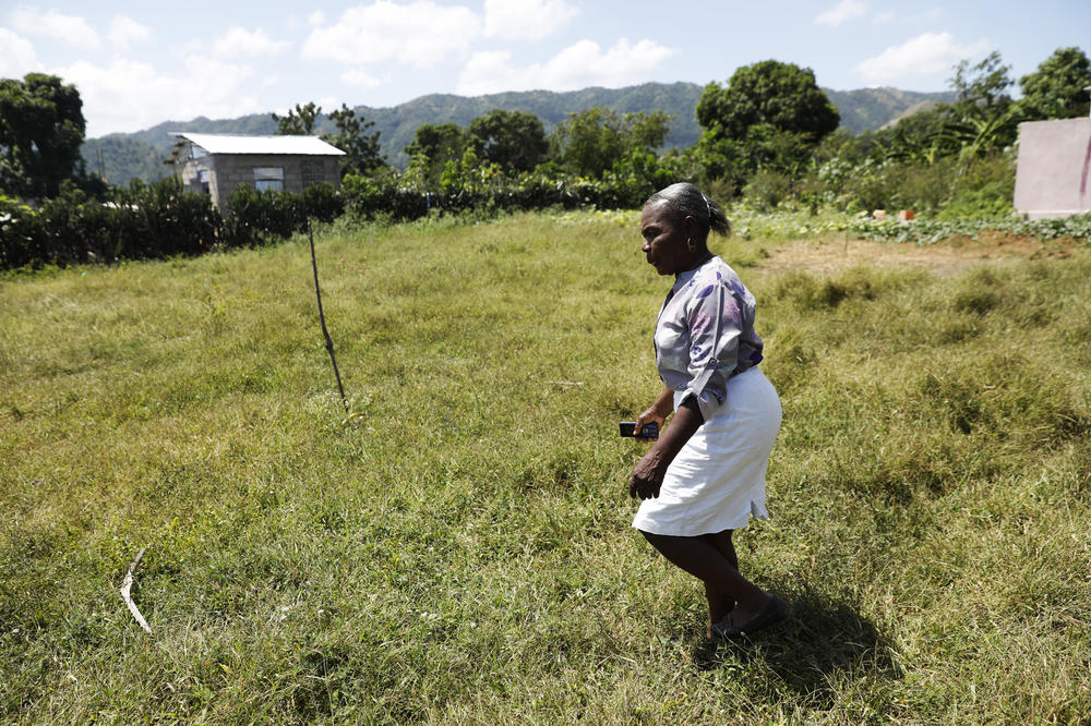 Moncher Metina walks in her hometown of Limonade, Haiti, on March 17, 2024.