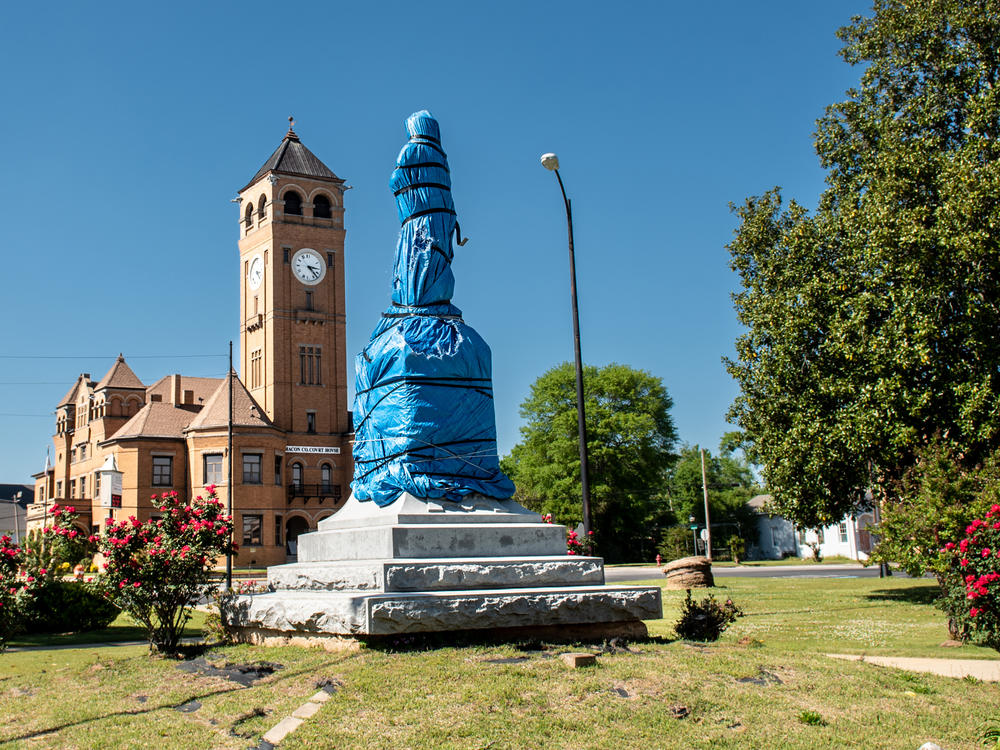 Council Member Johnny Ford and other residents of Tuskegee covered the town square's Confederate marker and monument with plastic. Ford has been trying to have the marker and statue removed since the 1970s, but the United Daughters of the Confederacy has fought to keep it in place.