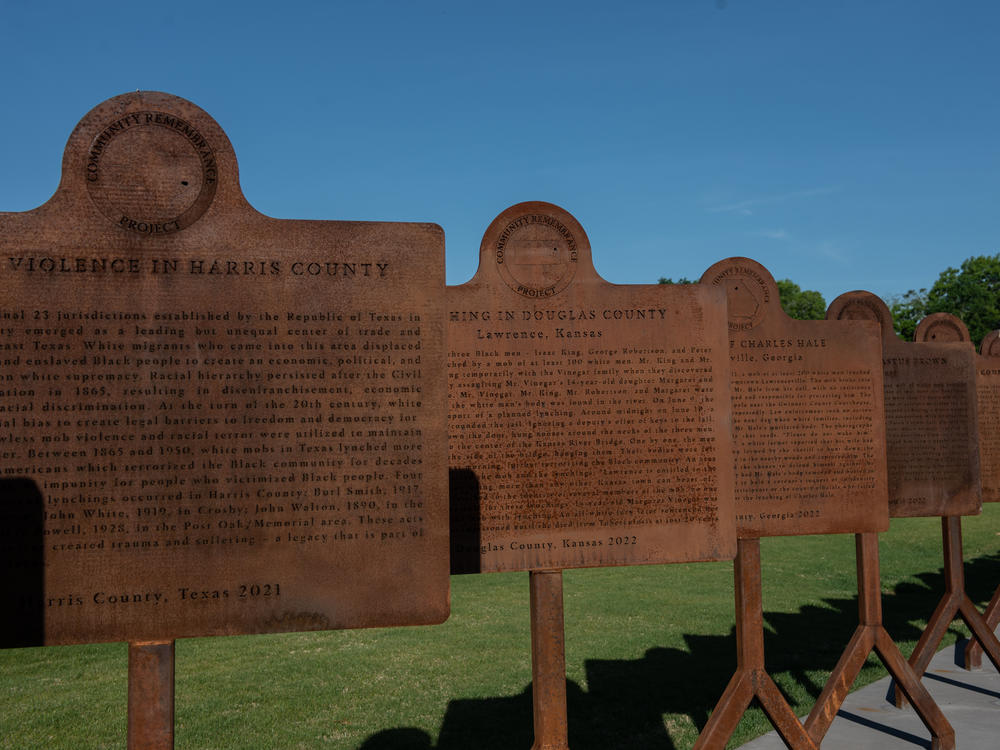 Duplicates of new markers line the pathway at the National Memorial for Peace and Justice in Montgomery. The Equal Justice Initiative has worked with more than 100 communities to help put up markers telling the stories of lynchings and racial terror.