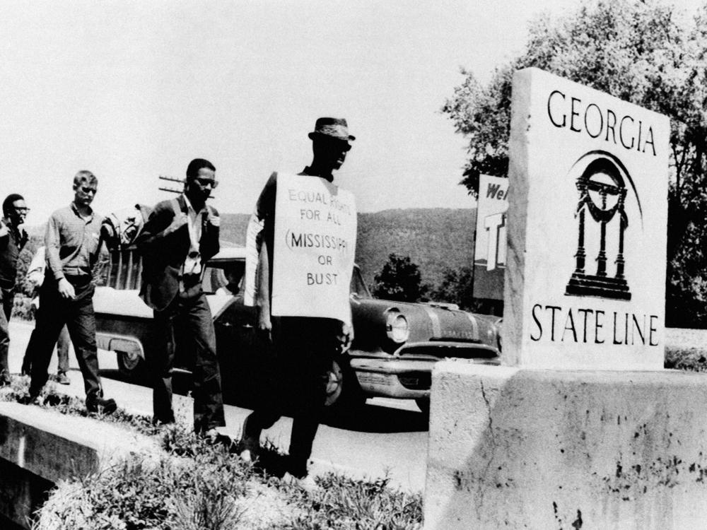 Civil rights activist Carver Neblett leads nine Freedom Marchers from Tennessee across the Georgia state line on May 1, 1963. The group retraced the route traveled by postal worker and civil rights activist William Lewis Moore, who was shot in Alabama on April 23, 1963.
