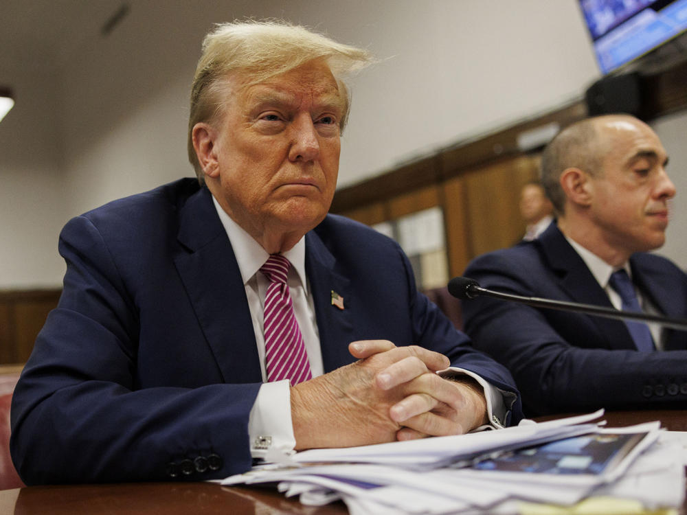 Former U.S. President Donald Trump sits at the defendant's table during his criminal trial as jury selection continues at Manhattan Criminal Court on April 19, 2024 in New York City. Trump was charged with 34 counts of falsifying business records last year, which prosecutors say was an effort to hide a potential sex scandal, both before and after the 2016 presidential election.