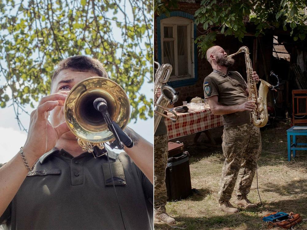 One band member plays a trumpet and another plays a saxophone in their Cultural Forces performance in eastern Ukraine's Donbas region.