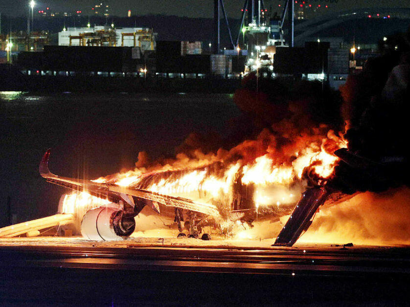 A Japan Airlines jet burst into flames after colliding with a Japanese coast guard plane at Tokyo's Haneda Airport in January. All 379 people on board the Japan Airlines flight were safely evacuated, but the incident raised questions about evacuation standards.