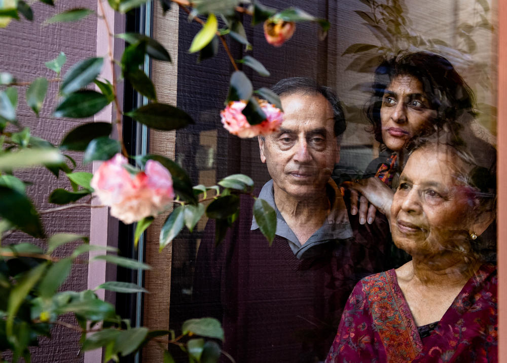 Hamida Bano (right) and her husband, Dr. Anil Chopra (left), with their daughter, Nasreen Chopra (center), in their Orinda, Calif., home in April 2020.
